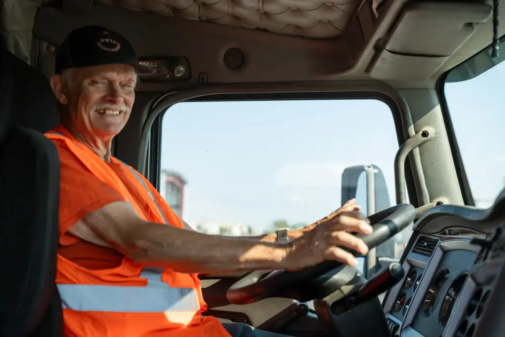 NW Trucking Academy instructor smiling behind the wheel