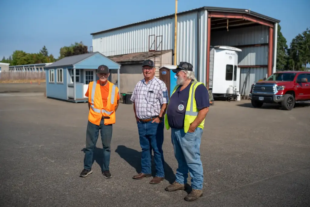 NW Trucking Academy instructors in front of the school's shop