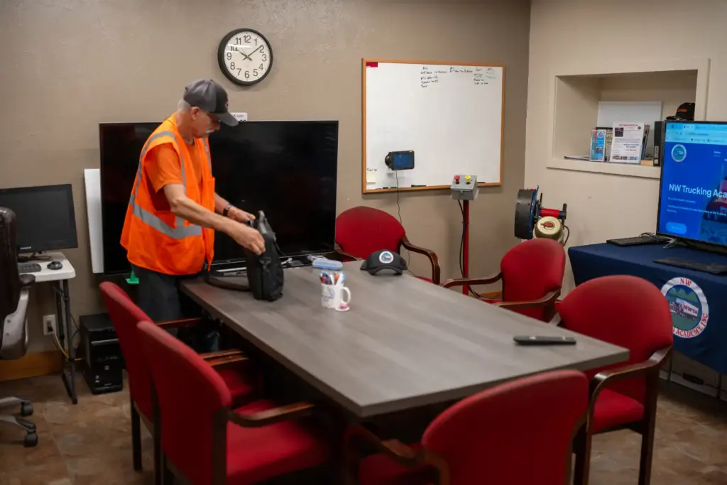 Instructor setting up the NW Trucking Academy classroom