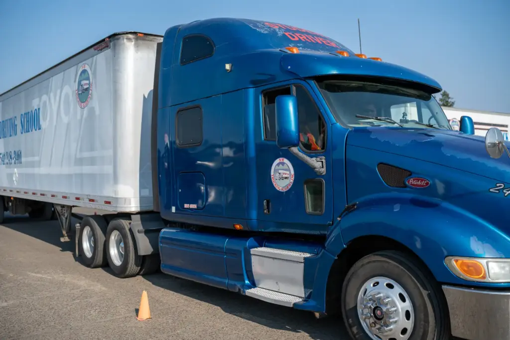 NW Trucking Academy training truck and trailer on the yard