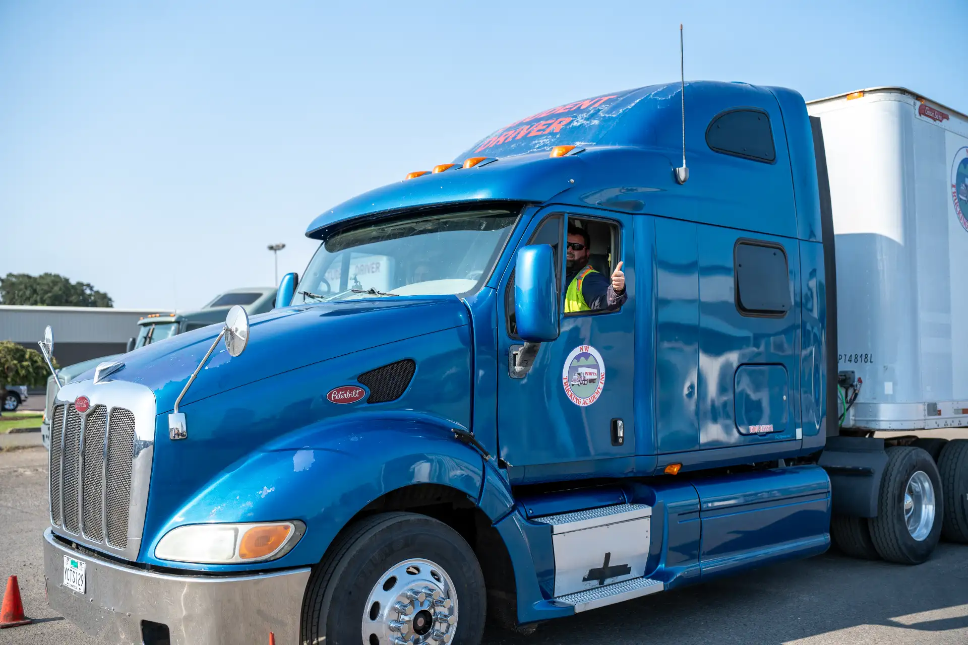 Driver behind the wheel of an NW Trucking Academy training truck